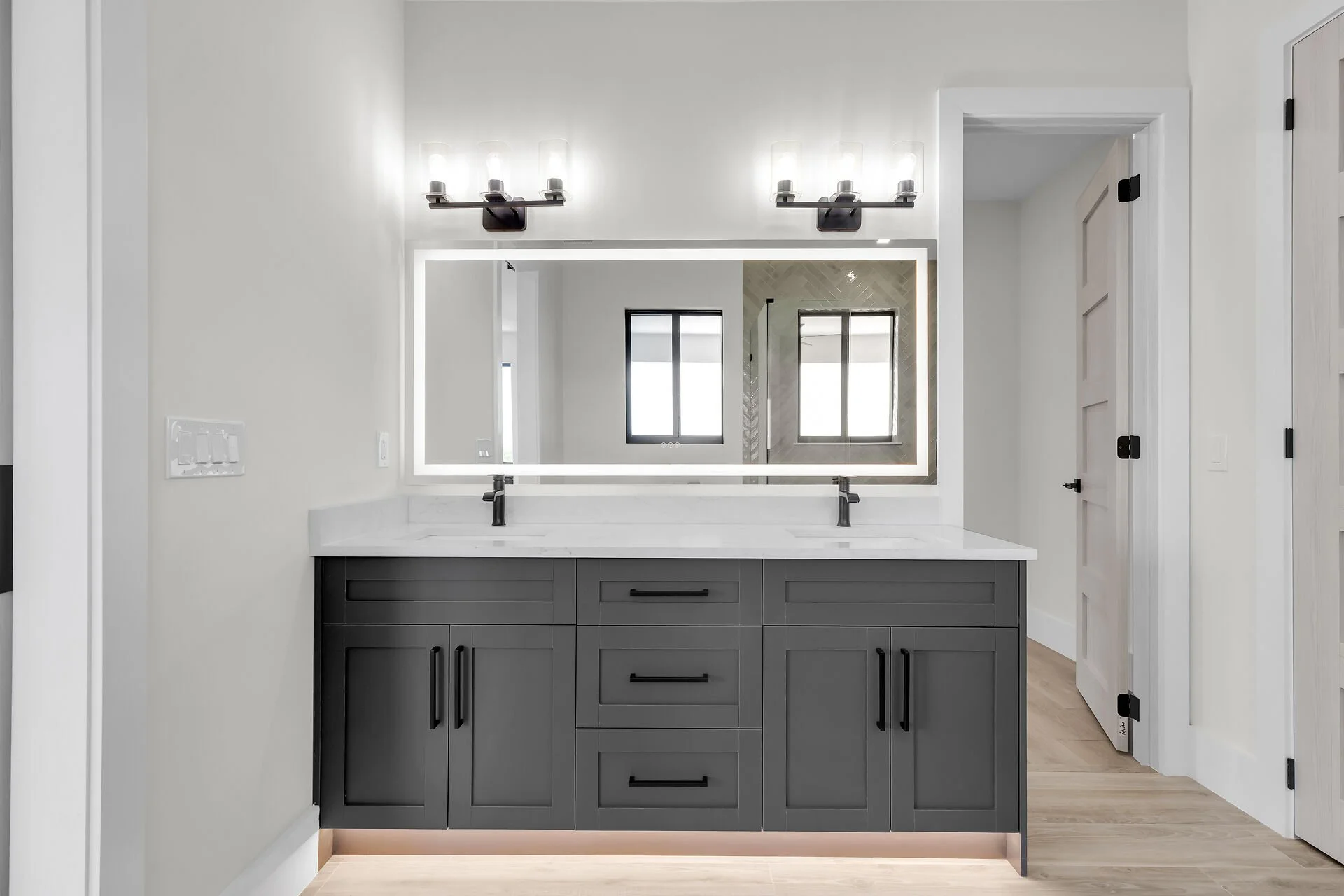 Designer bathroom with frameless glass shower in Stirrup Key luxury home