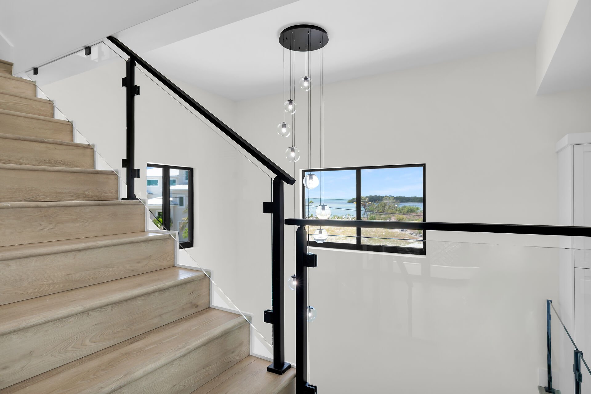 Modern Glass Staircase in Marathon Florida pool home