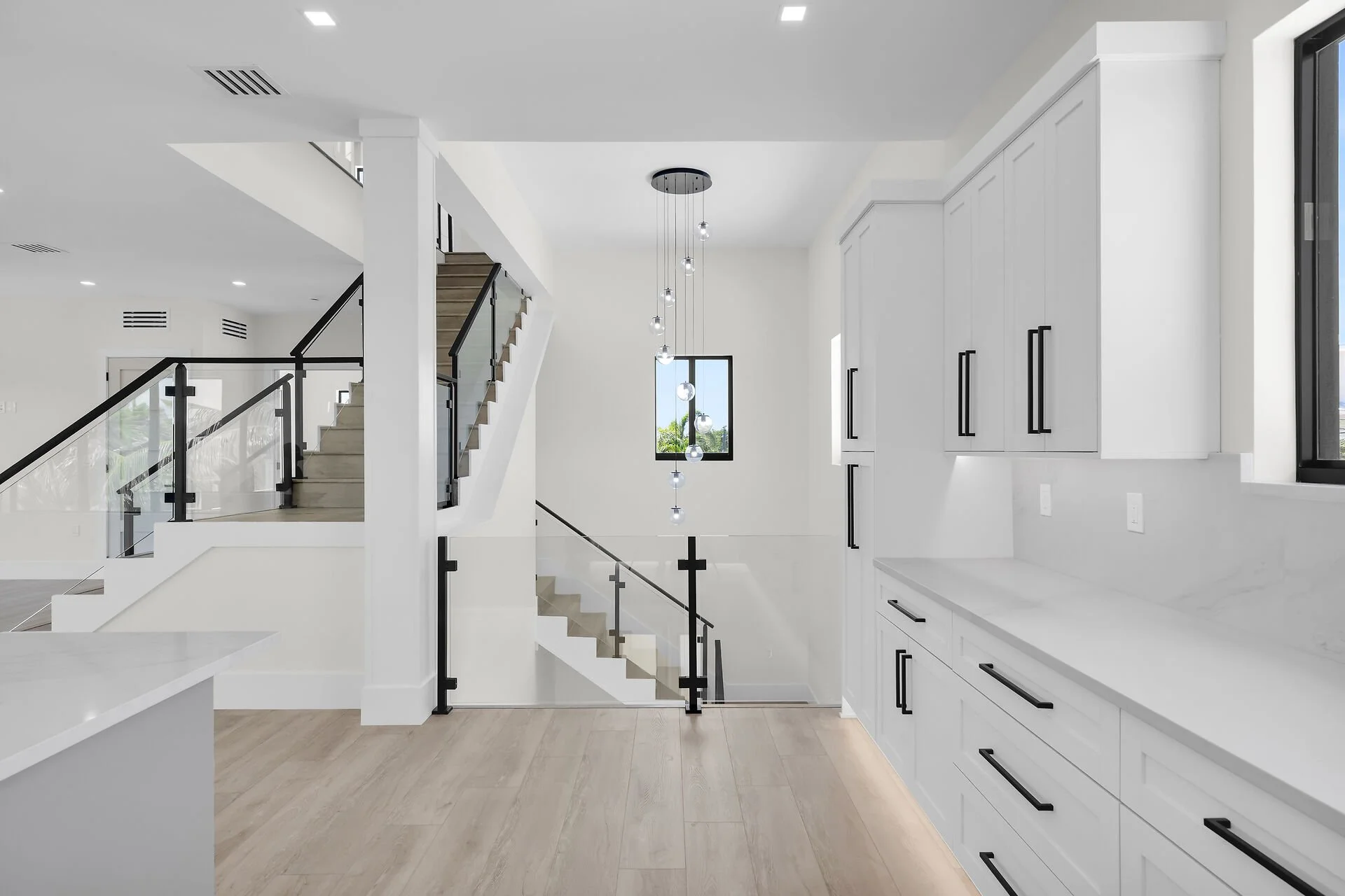 Modern luxury kitchen with quartz counters inside Marathon Florida waterfront home