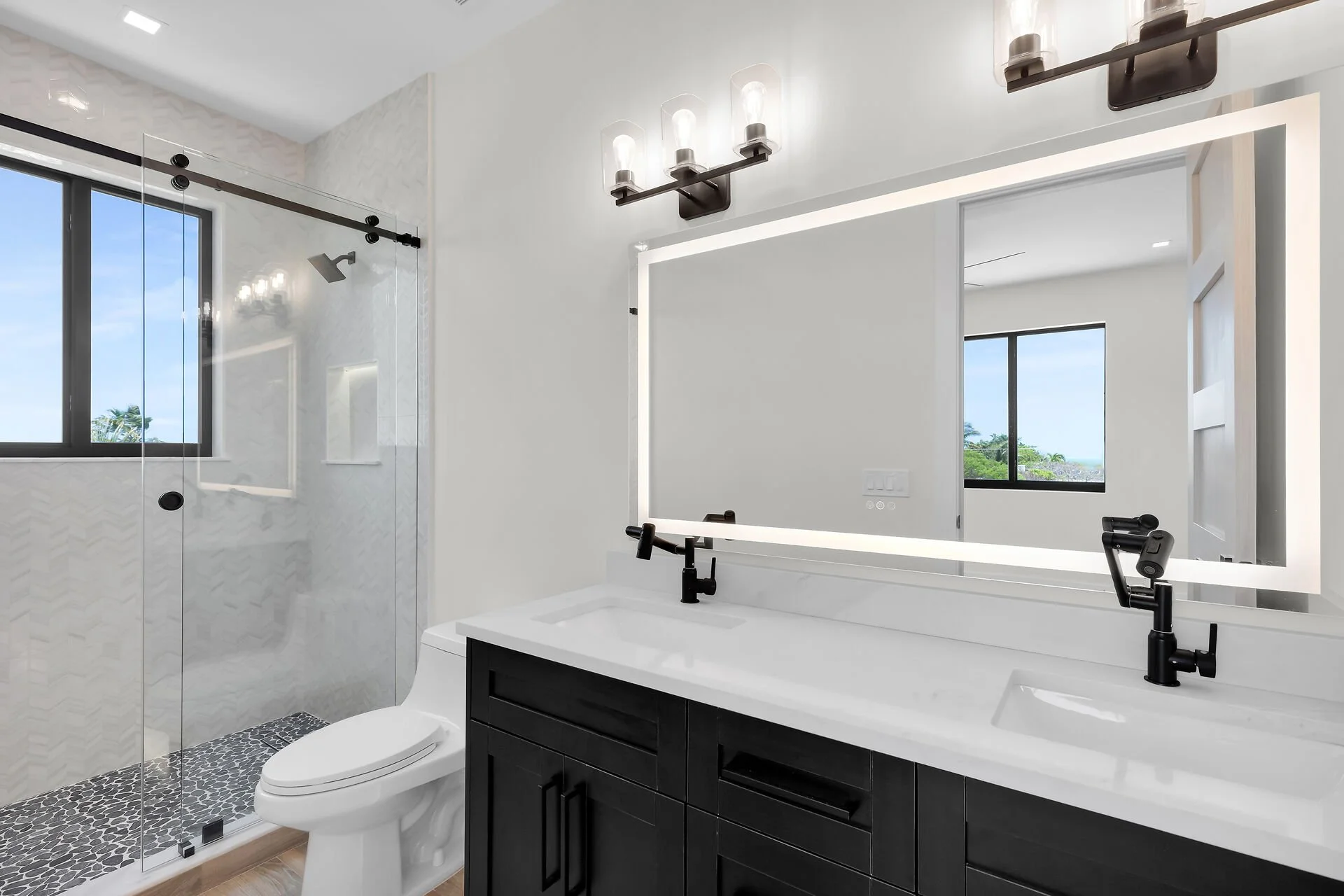Designer bathroom with custom tiled shower in Stirrup Key luxury home