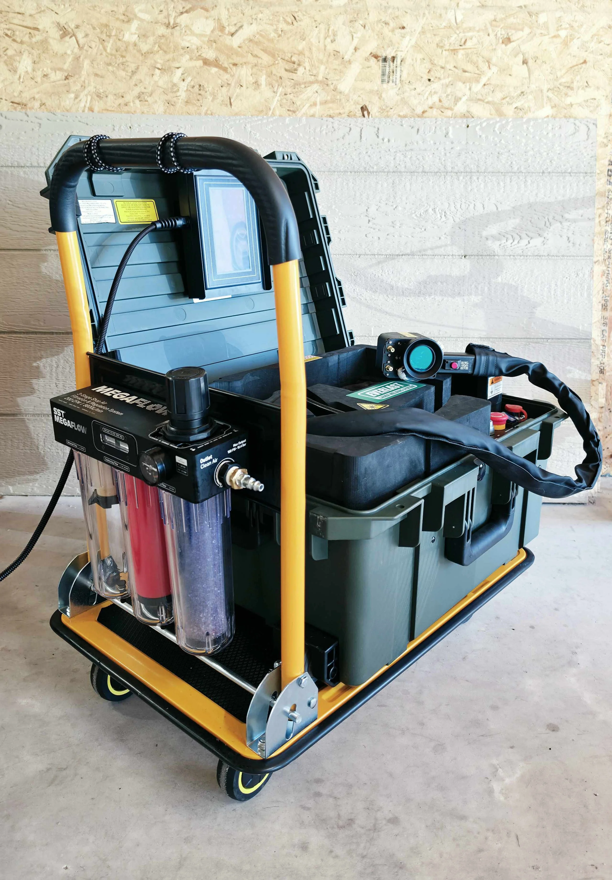 Custom mobile laser cleaning cart with integrated filtration system and industrial laser equipment.