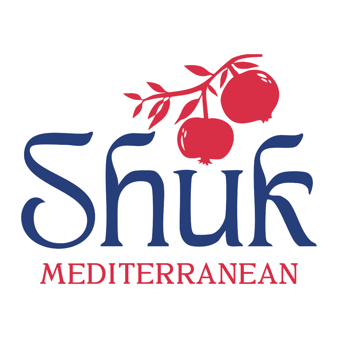 Logo with the word "Shuk" in large blue letters, a branch with red pomegranates above, and the word "Mediterranean" in smaller red letters below.