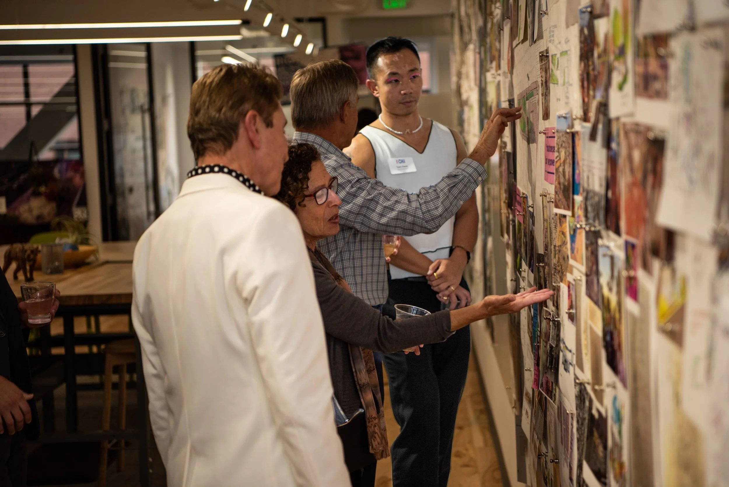 Four people looking at civil rights images.