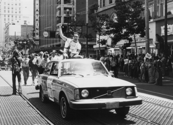 Harvey Milk rides atop a car in the 1978 Gay Freedom Day Parade in San Francisco