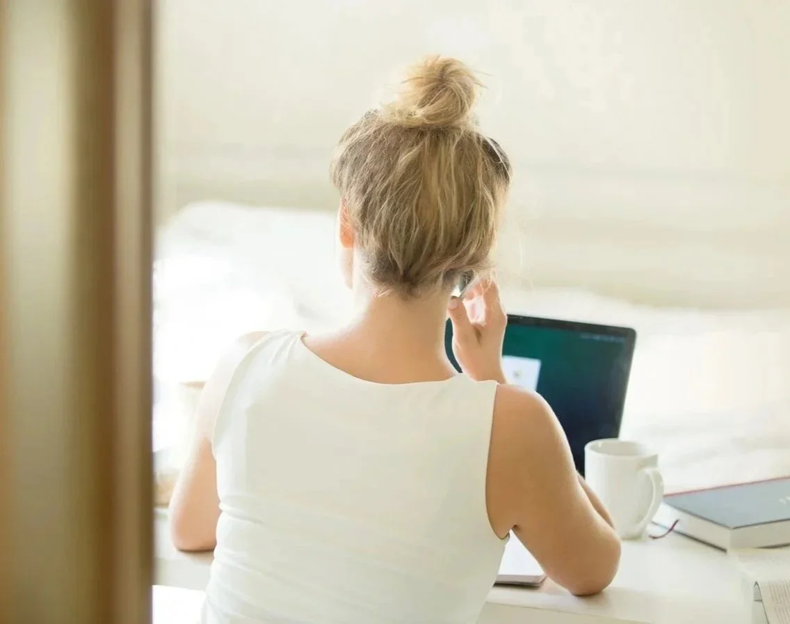 Woman planning health and fitness goals as part of a personalized coaching program for midlife wellness.