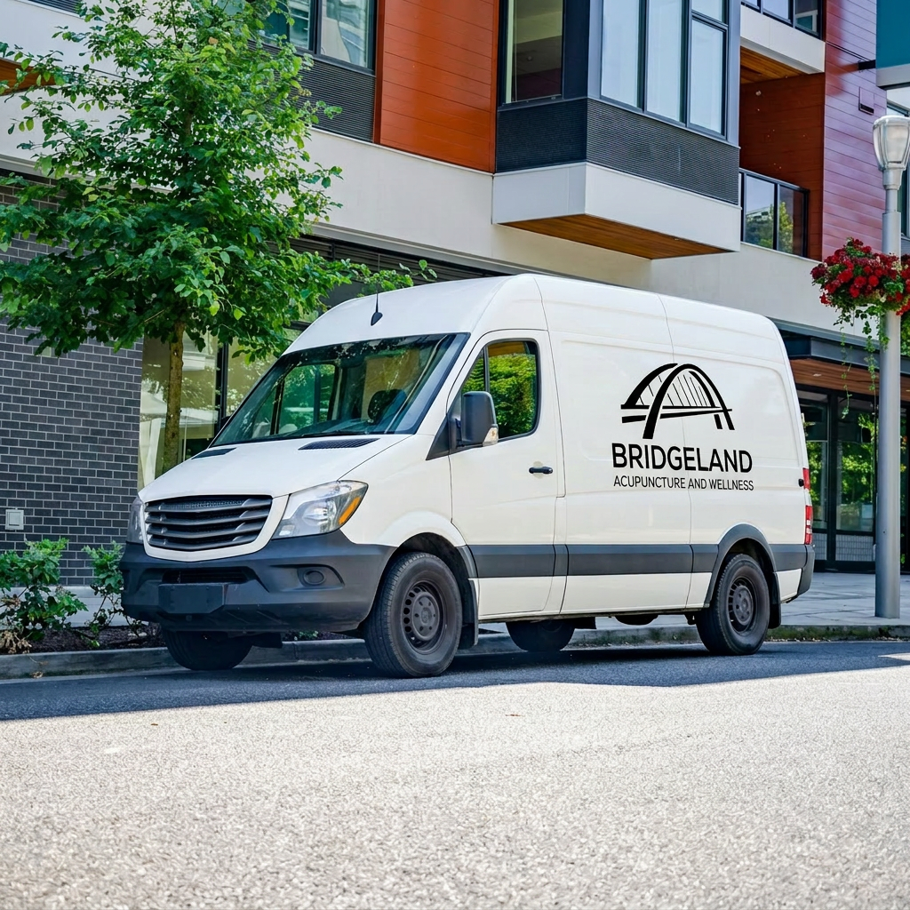White commercial van with BridgeLand Acupuncture and Wellness logo parked on city street near modern apartment building.