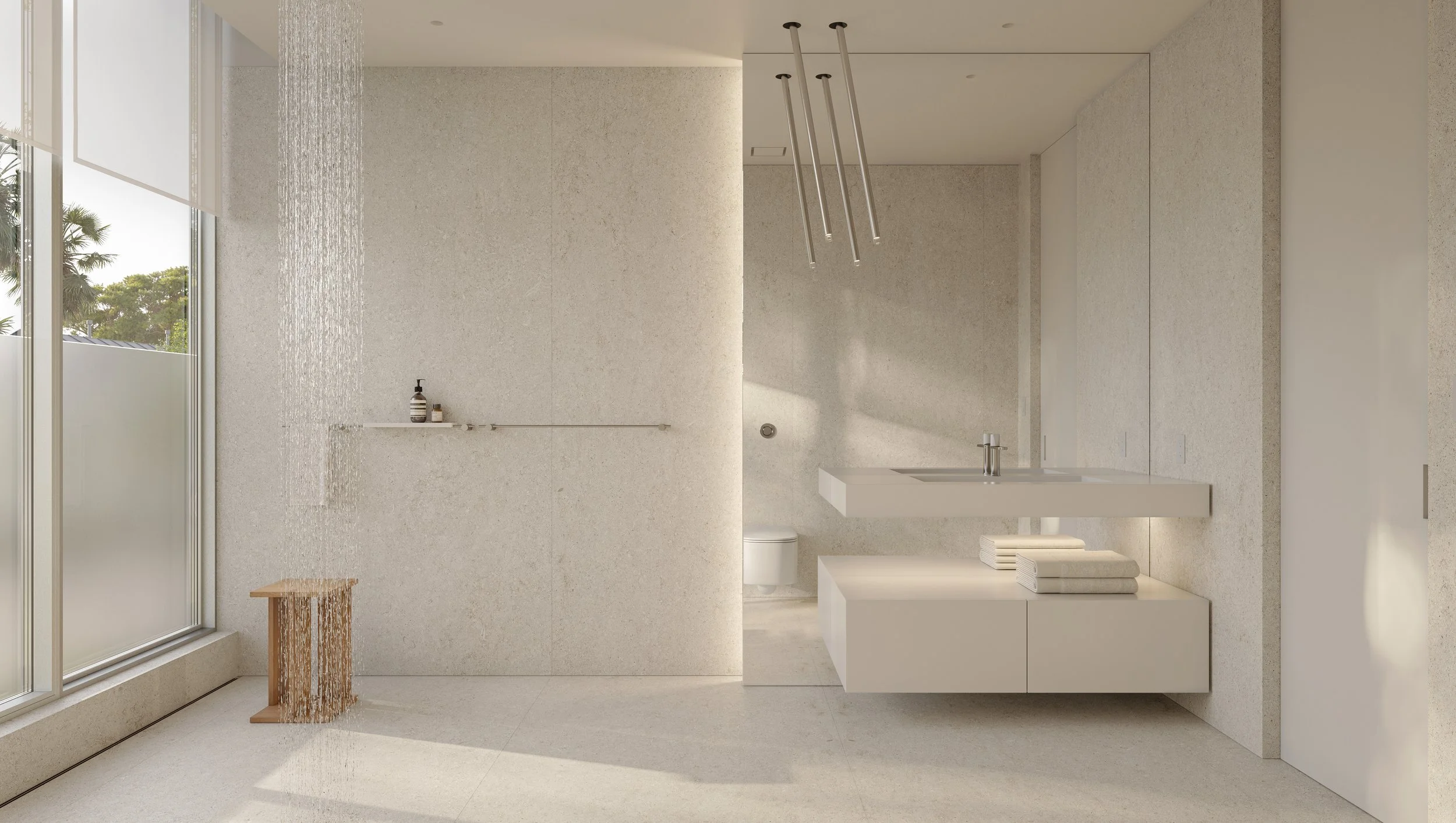 Modern minimalist bathroom with a large window, textured beige walls, a ceiling-mounted shower with rainfall head, a wall-mounted sink, and a toilet, featuring neutral color tones and natural lighting.