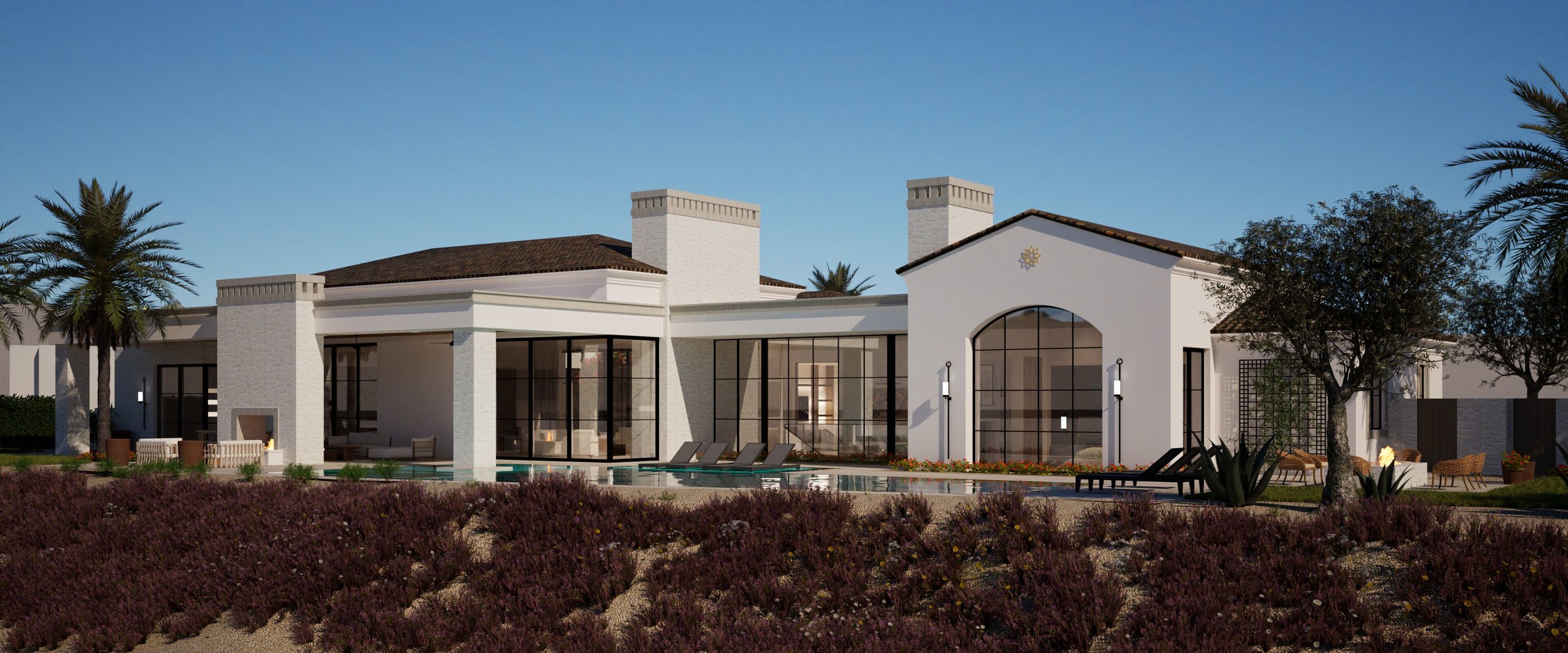 Modern house with large glass windows, surrounded by palm trees and desert plants, under a clear blue sky.
