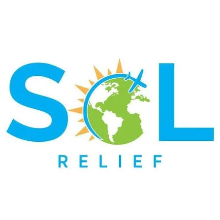 Logo for SOL Relief featuring the Earth with a plane flying around it, a sun behind, and the words 'SOL RELIEF'.