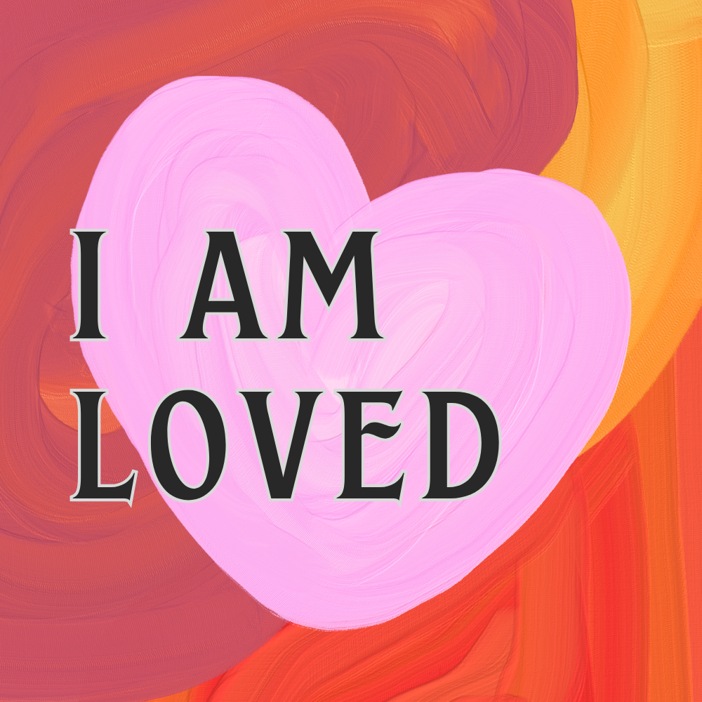 Pink heart on an orange and red painted background with the words "I AM LOVED" written across it.