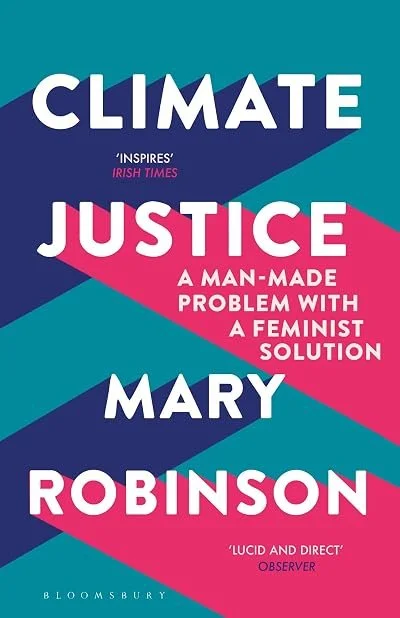 Book cover with bold white text on a blue and pink background; title 'Climate Justice' by Mary Robinson, with quotes praising its inspiration and lucidity.