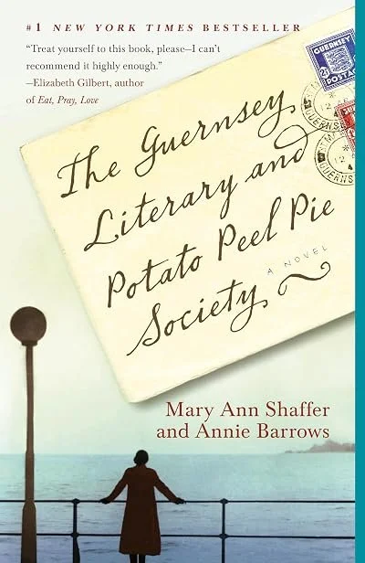 Book cover titled 'The Guernsey Literary and Potato Peel Pie Society' by Mary Ann Shaffer and Annie Barrows, featuring a handwritten letter with postage stamps and a scene of a woman by the water.