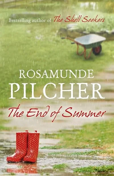 Book cover for 'The End of Summer' by Rosamunde Pilcher. Features a pair of red rain boots on a wet path with a green grassy background and a wheelbarrow.