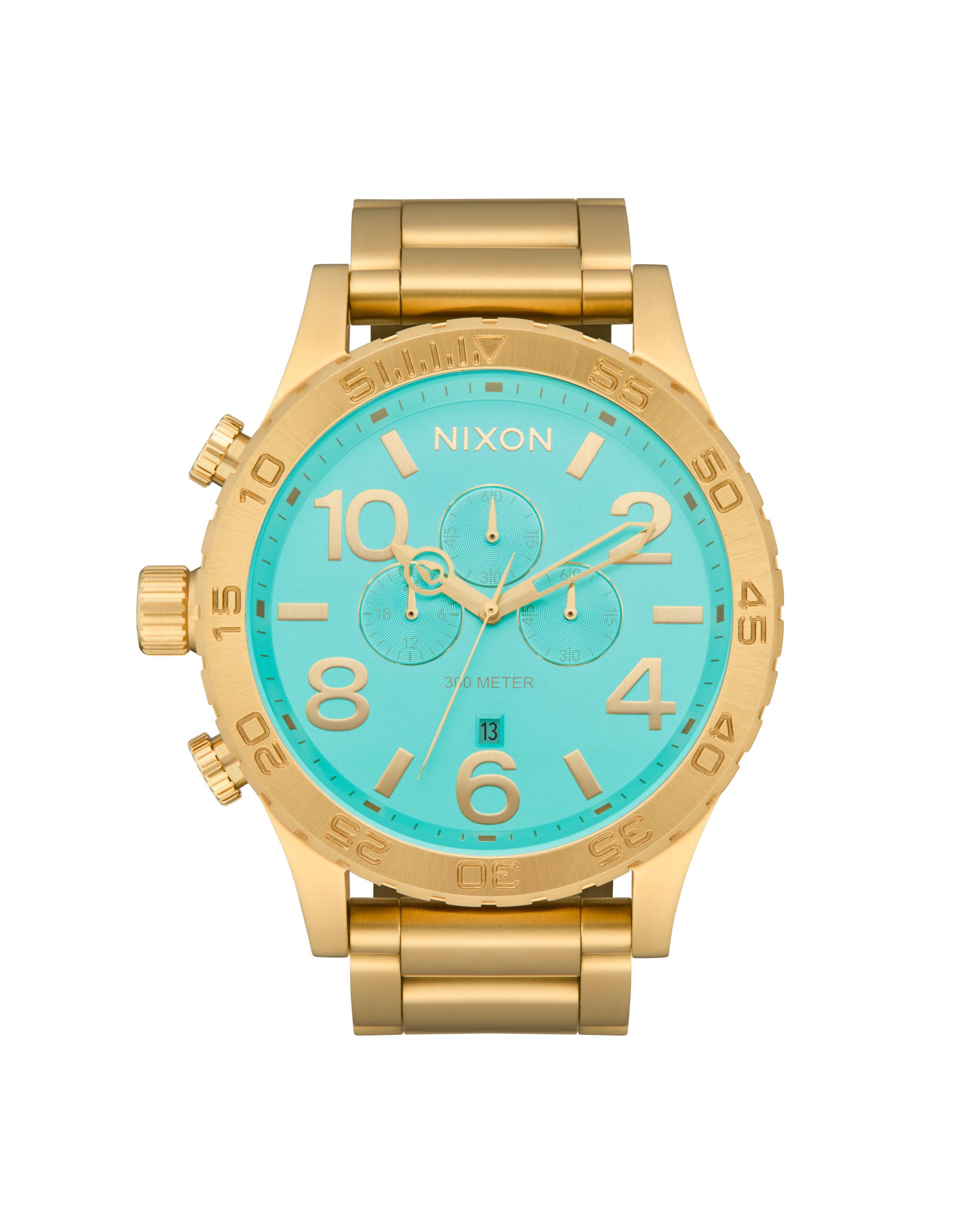 Retouched e-commerce image of a gold wristwatch with a turquoise dial, featuring chronograph subdials and gold markers, with the 'NIXON' on the face.