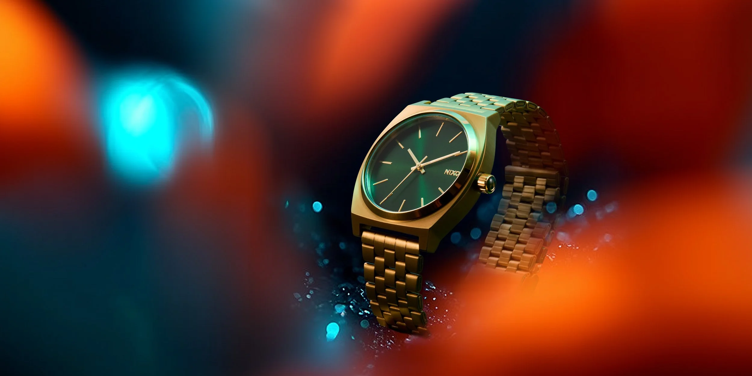 Composited AI background and retouched product shot of a NIXON gold wristwatch with a green dial, gold hands, and a metal band resting on a colorful, blurred background with blue, orange, and red lights.