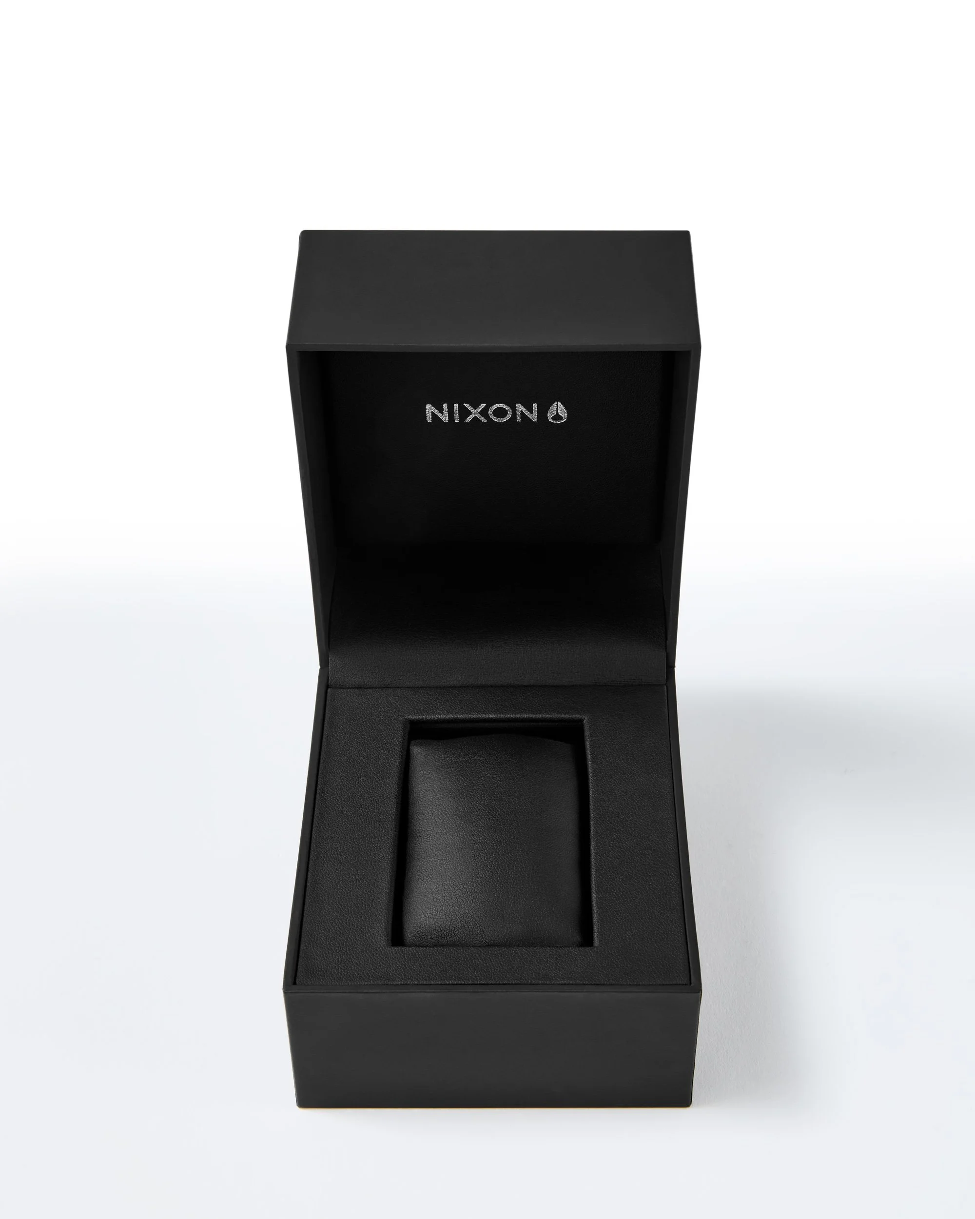 A retouched shot of a black leather packaging with the brand name 'NIXON' on the front.