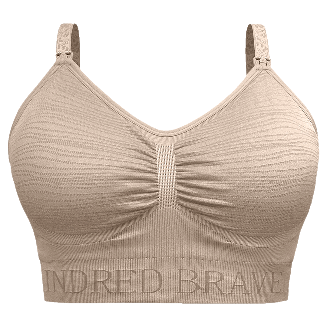 Unretouched ghost image of a beige sports bra with adjustable straps and a wide bottom band that reads "KINDRED BRAVELY."
