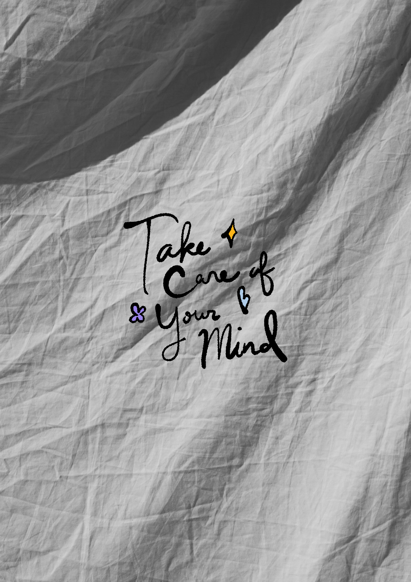 A crumpled piece of paper with handwritten text that reads, 'Take care of yourself. Your mind,' decorated with small colorful heart and flower doodles.