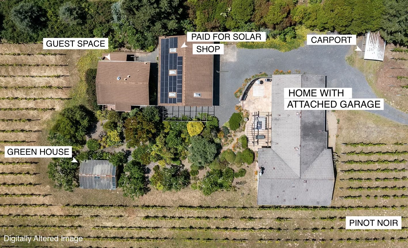 Aerial view of a property with labeled areas including a guest space, green house, paid for solar shop, home with attached garage, carport, and a vineyard of Pinot Noir grapes.