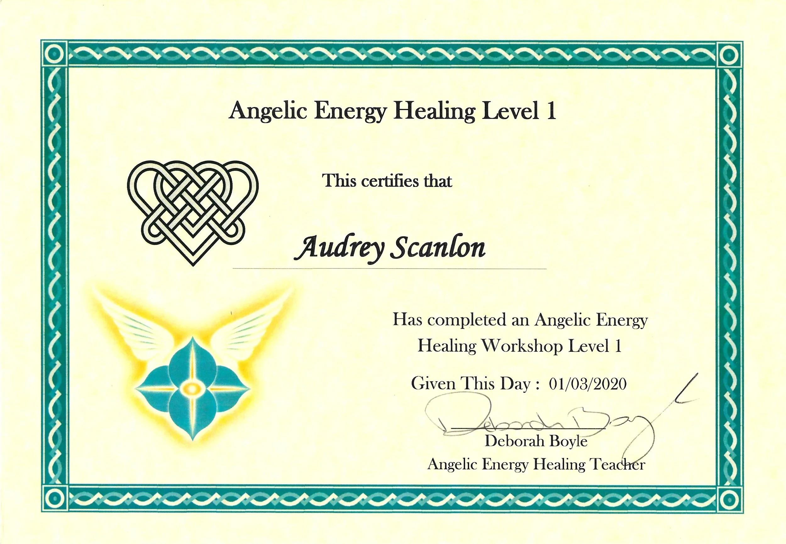 A certificate titled 'Angelic Energy Healing Level 1' awarded to Audrey Scanlon, signed by Deborah Boyle, an Angelic Energy Healing Teacher, dated 01/03/2020. The certificate features decorative turquoise borders and a yellow and blue angelic design on the left side.