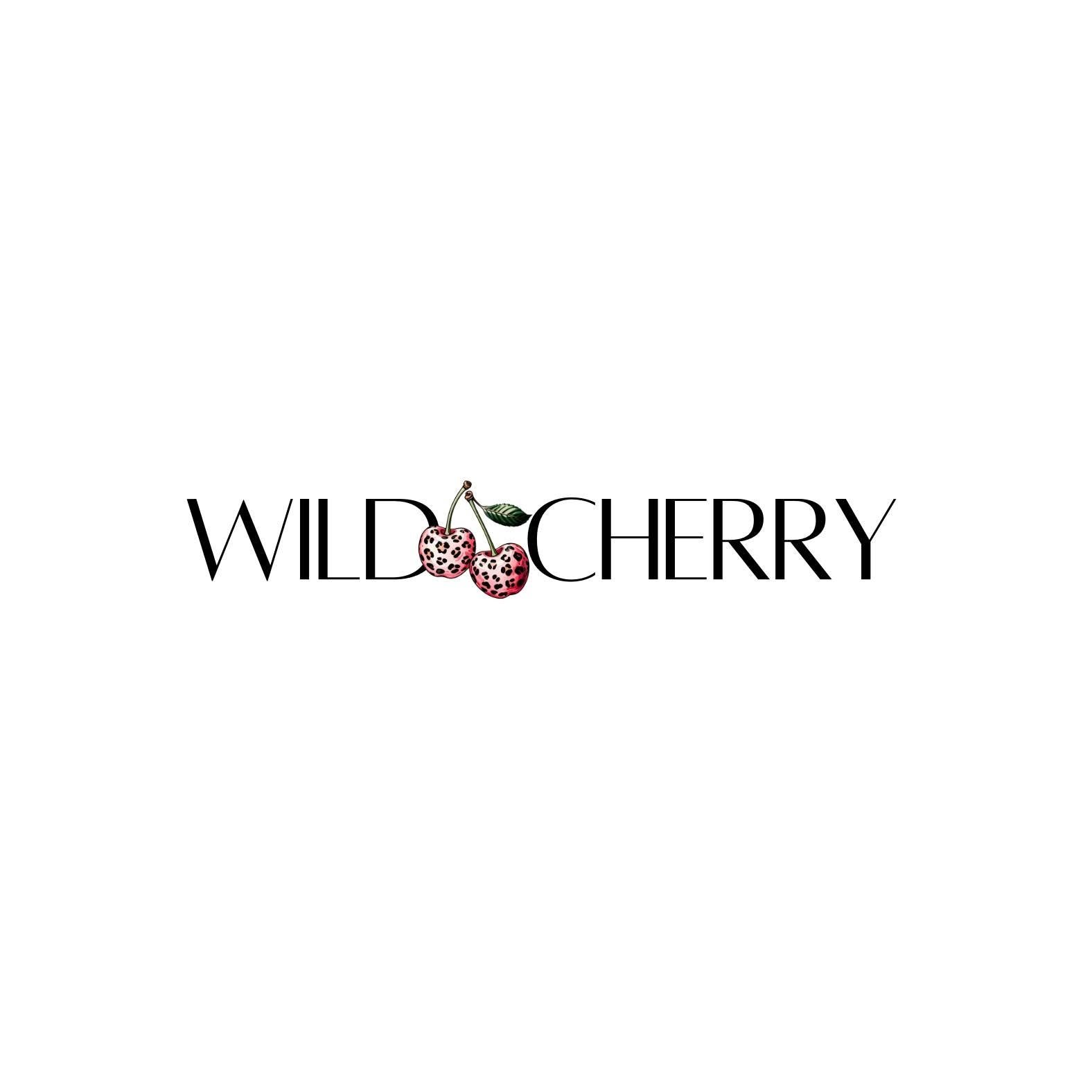 The logo for WILD CHERRY featuring two pink and black spotted cherries with green leaves above the text.
