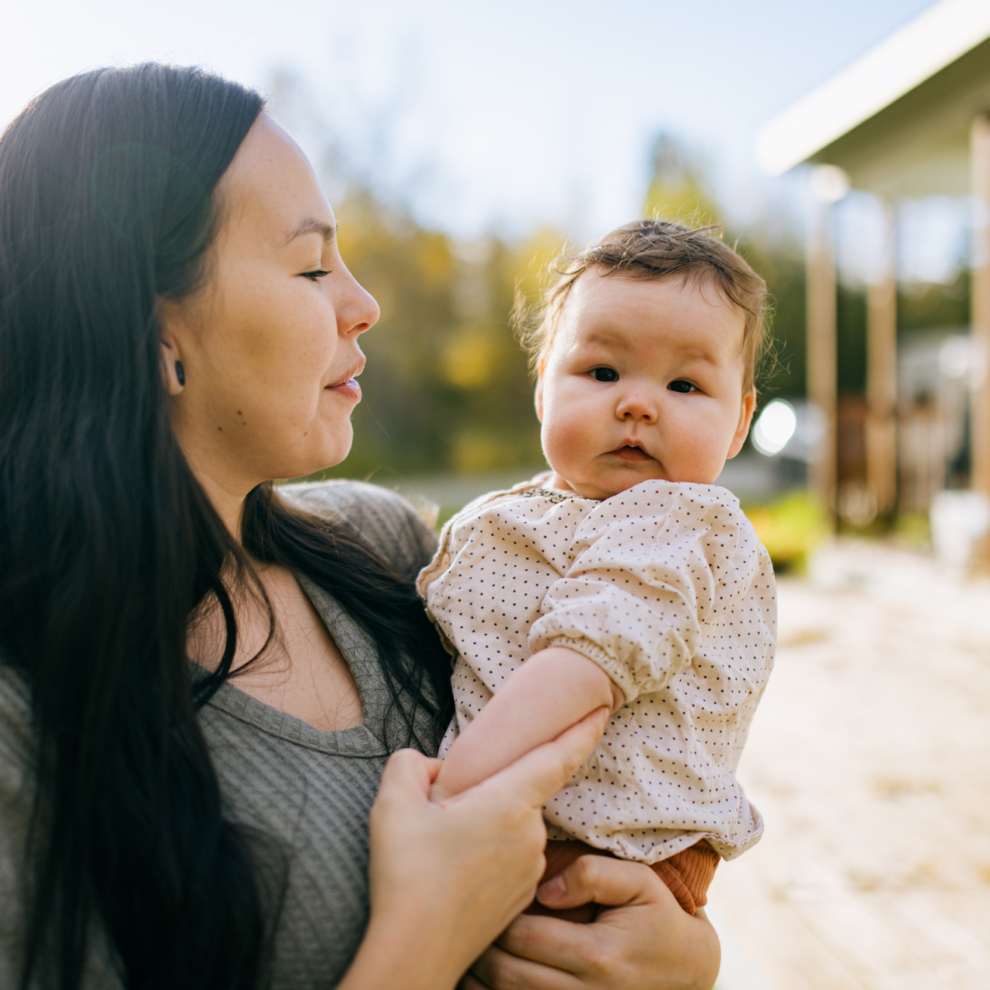 a woman holding her baby