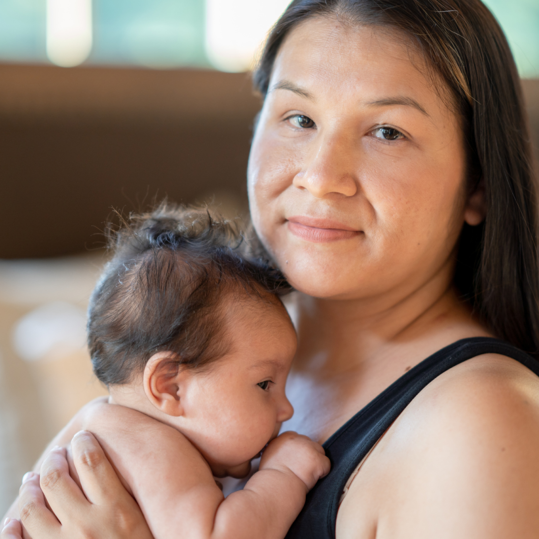 an image of a woman holding her infant baby