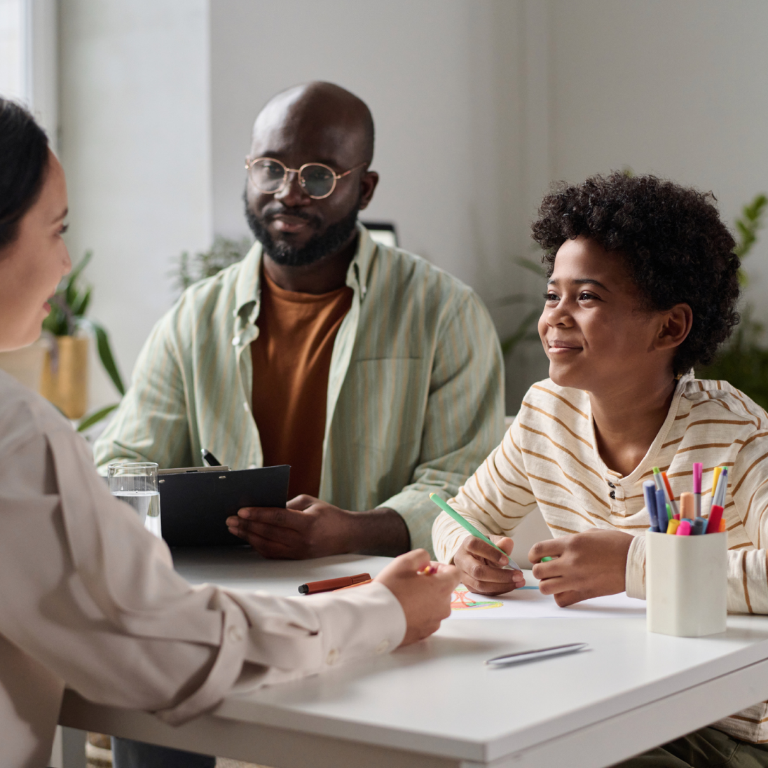 a father and son talking to a counselor