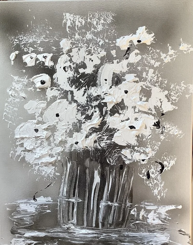 Abstract image of gray background with a vase of white flowers
