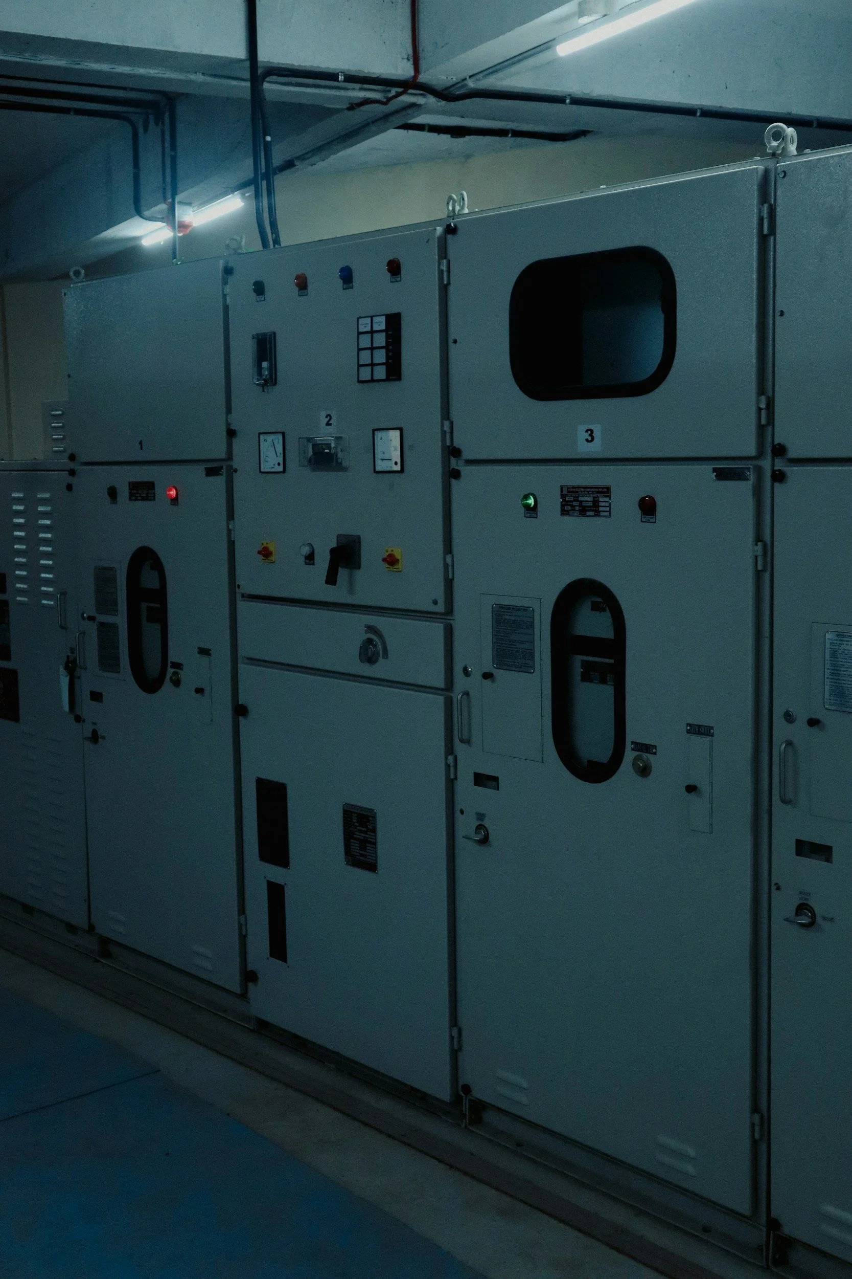 An industrial electrical control panel with various gauges, switches, and indicator lights. Generator and standby power service in Oregon
