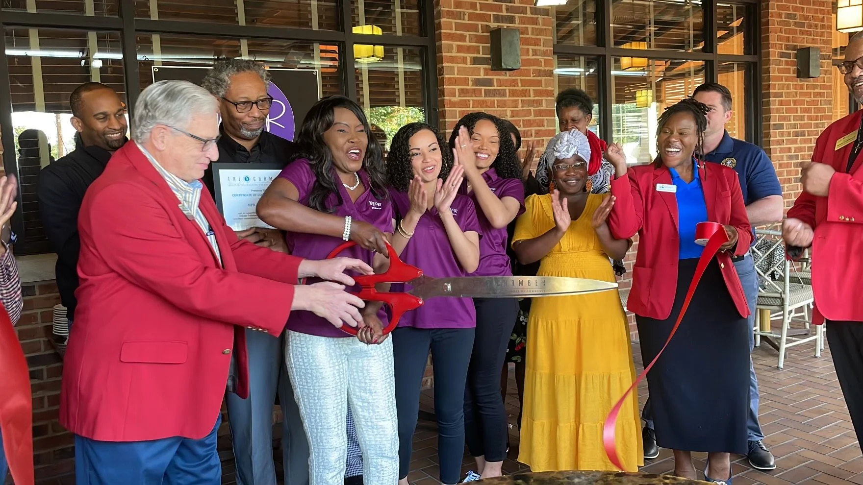 Marie (Owner) and daughters are pictured here with The Greater Tallahassee Chamber of Commerce. Excitement is evident during a ribbon-cutting event celebrating the start of MPR Events LLC.