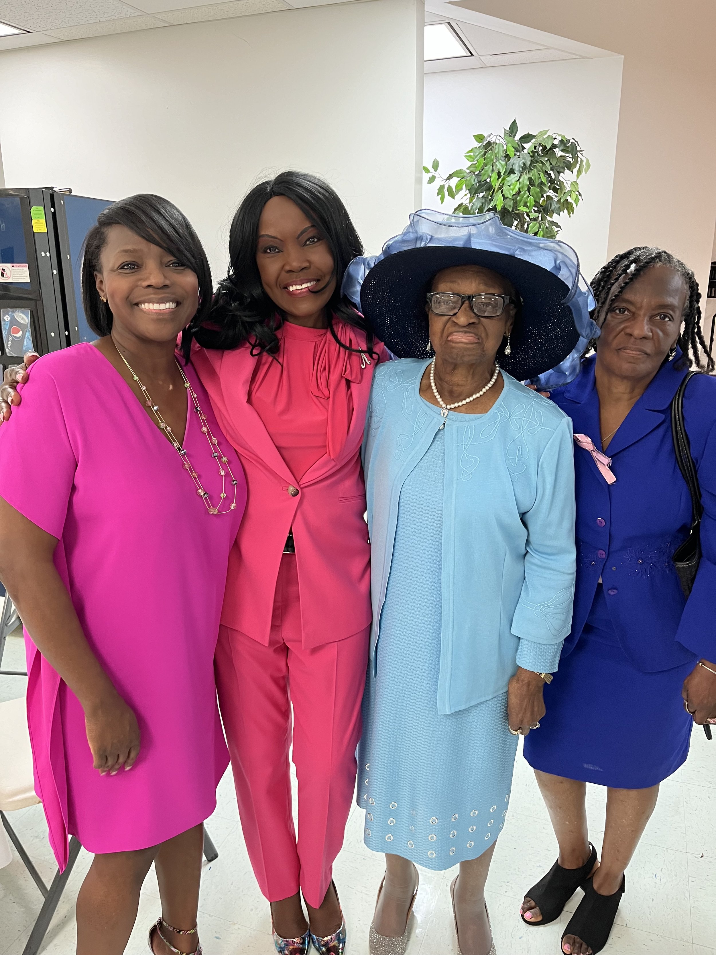 Marie (Owner) appearing happy and vibrant with a group of women