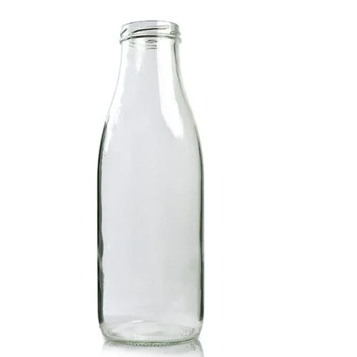 Empty glass milk bottle on a white background.