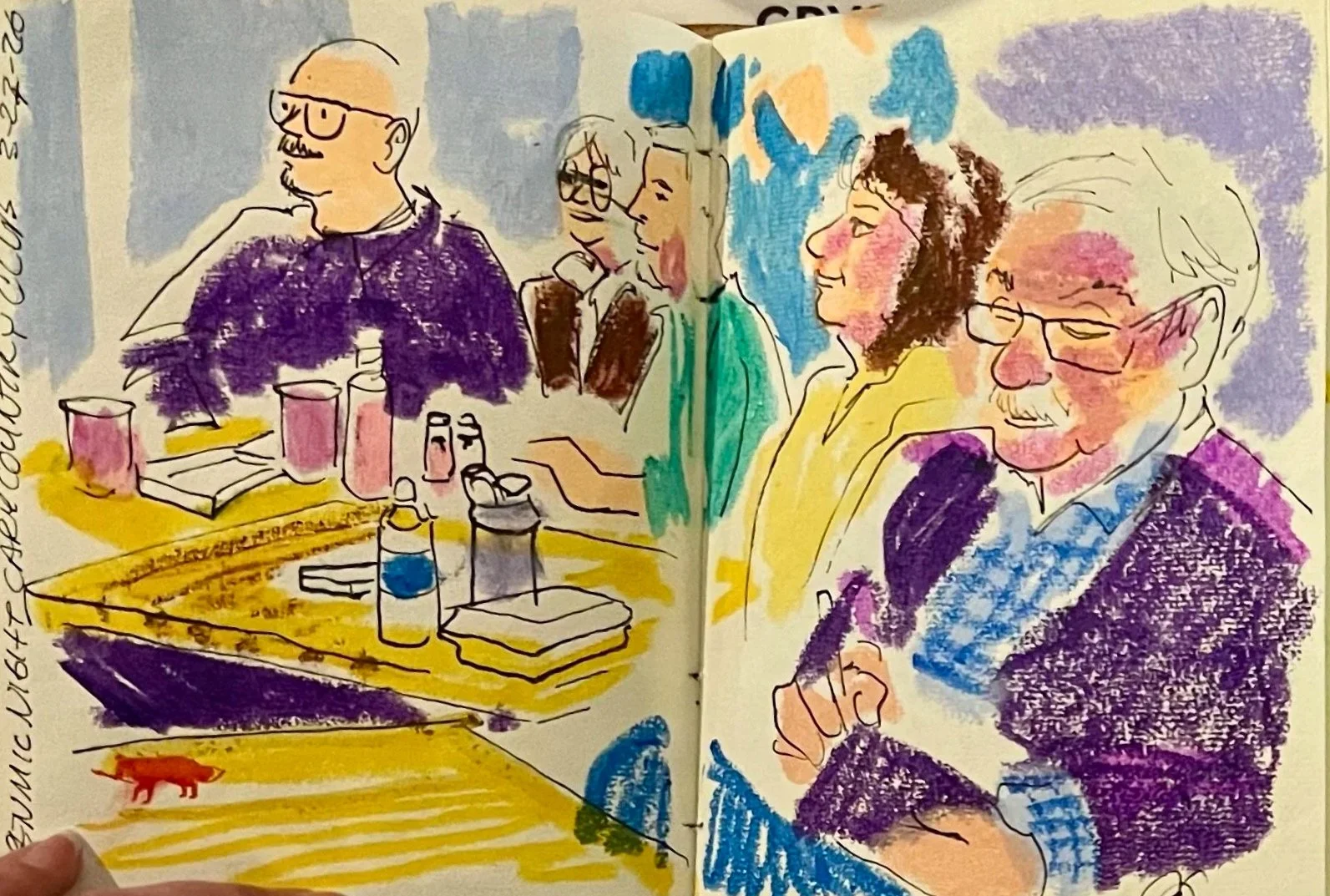 Colorful sketch of five people sitting at a table, engaged in a discussion or meeting. The table has various bottles and objects, with a small orange animal figure on it. The individuals are of different ages and appearances, some wearing glasses, and are depicted with expressive, loose lines and watercolor-like coloring.