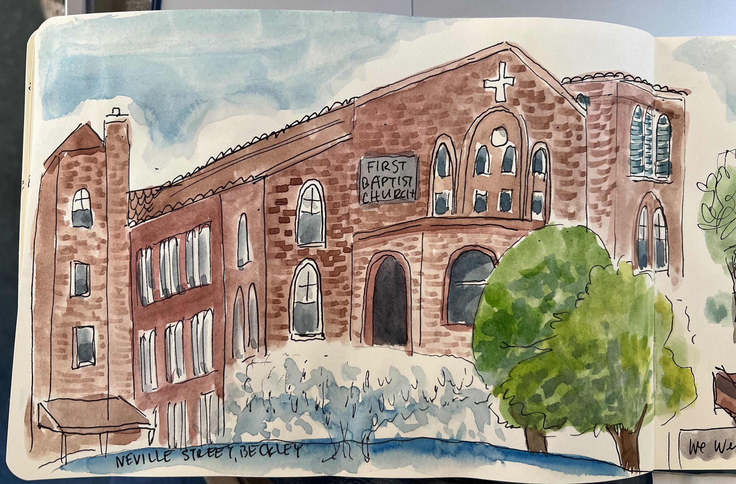 A watercolor sketch of First Baptist Church on Neville Street in Beckley, with a brown brick facade, arched windows, a brick cross on the roof, and a sign reading 'First Baptist Church'. There are trees and a cloudy sky in the background.