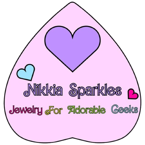 A teardrop-shaped sign with a large purple heart at the top, smaller hearts on the sides, and the text 'Nikkia Sparkles Jewelry For Adorable Geeks' in colorful and playful fonts.