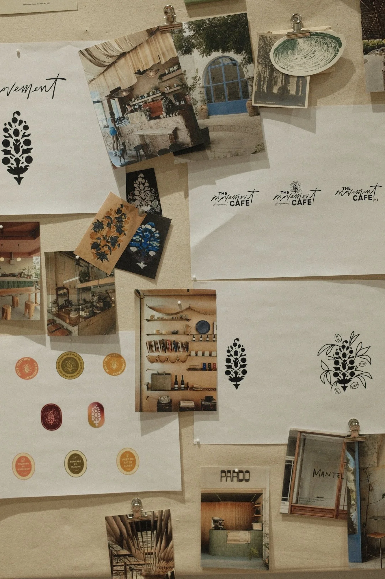 Collage of photos and graphics on a bulletin board, including images of café interiors, outdoor scenes, and various design elements, along with logos and inspirational quotes.