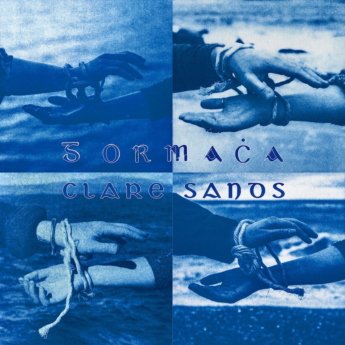 Four hands with tied wrists reaching towards each other, with text 'Sormàça Clare Sano' overlaying the image.
