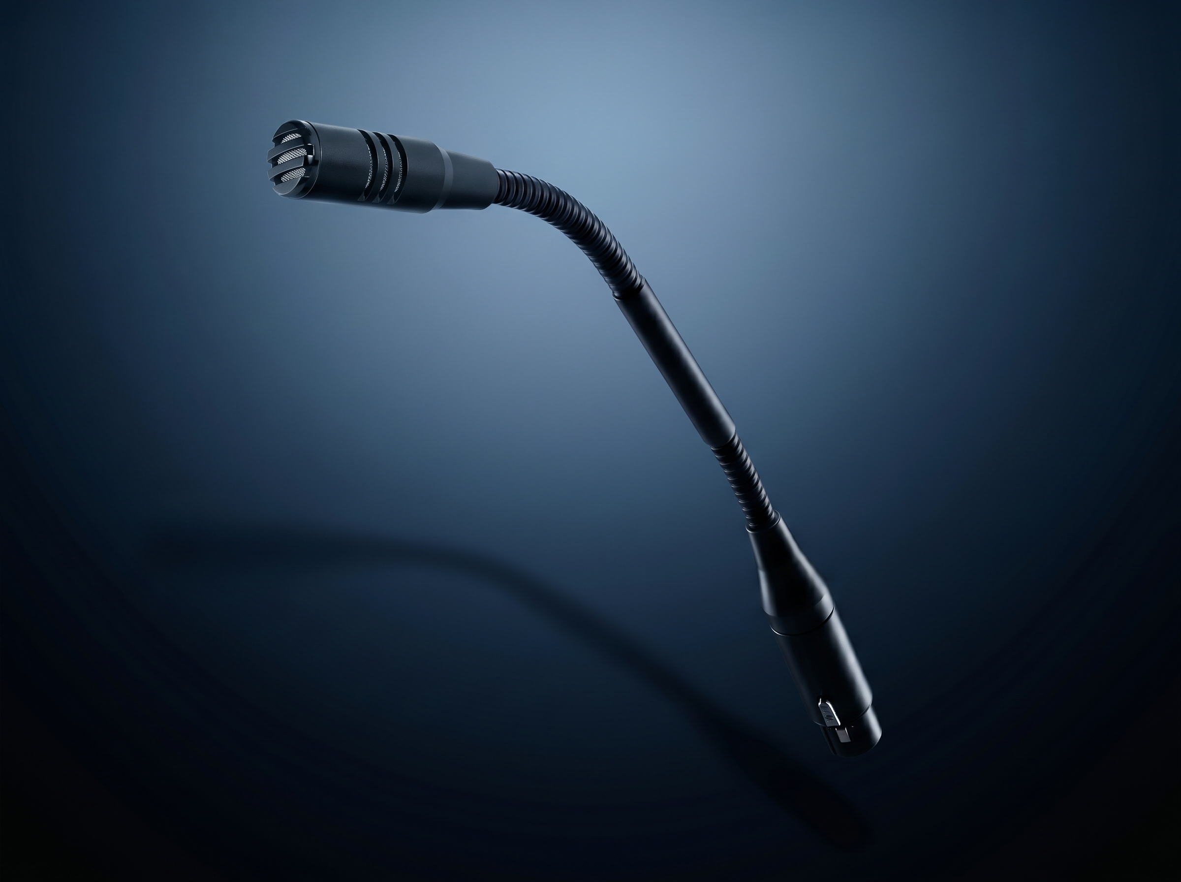 Close-up of a black microphone with a flexible stalk against a dark gradient background.