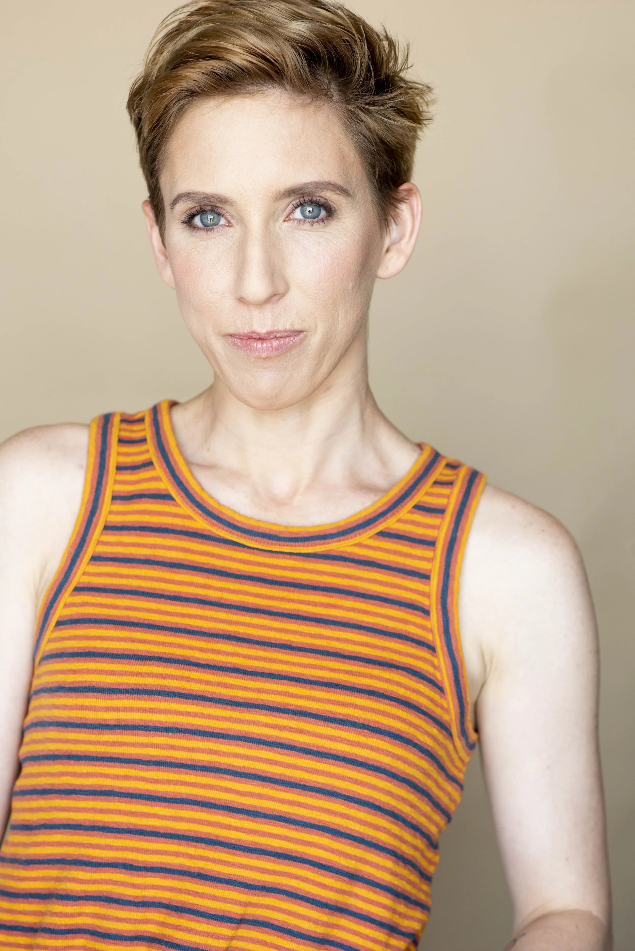 Hayley headshot orange 1.jpg