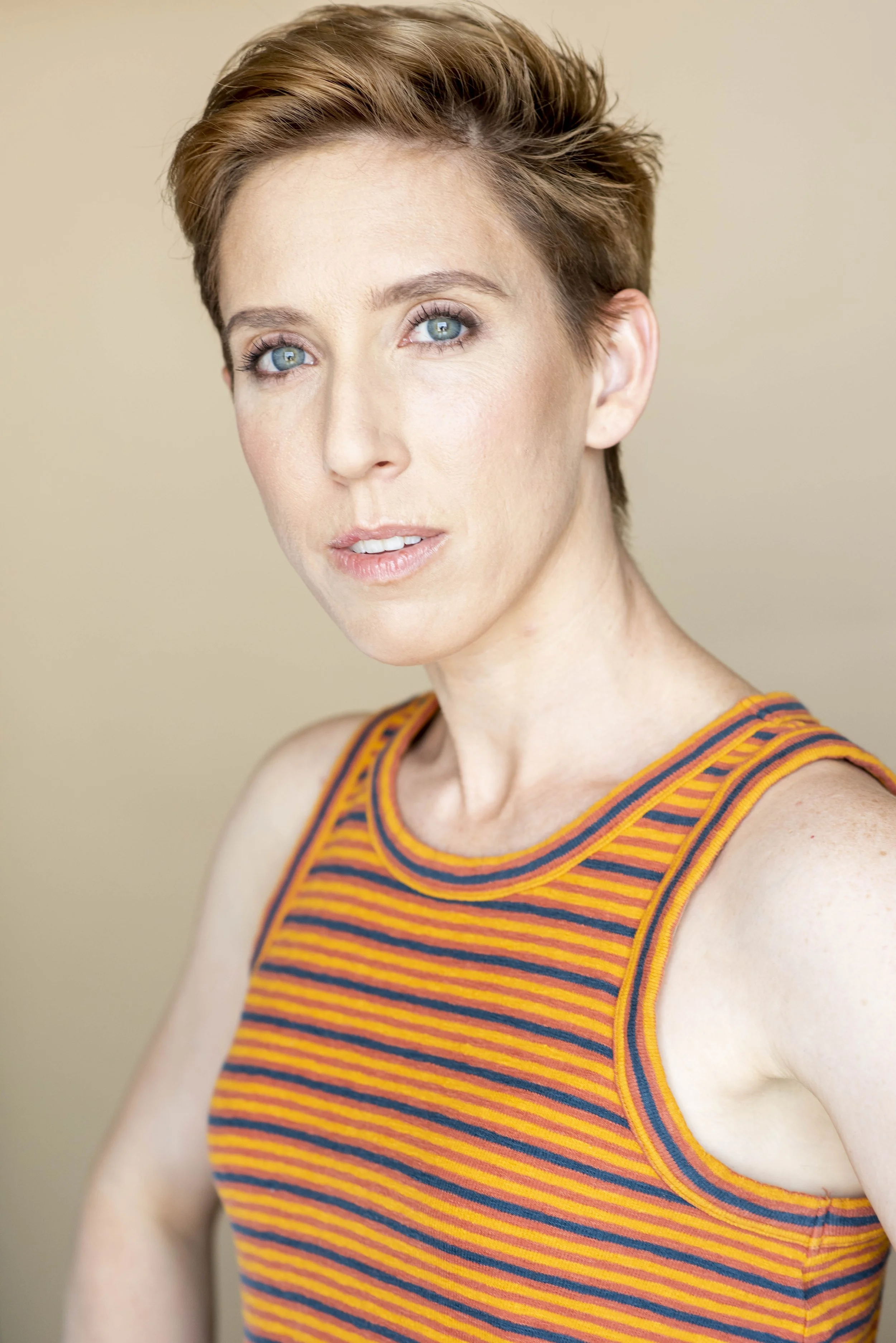 Hayley headshot orange 2.jpg