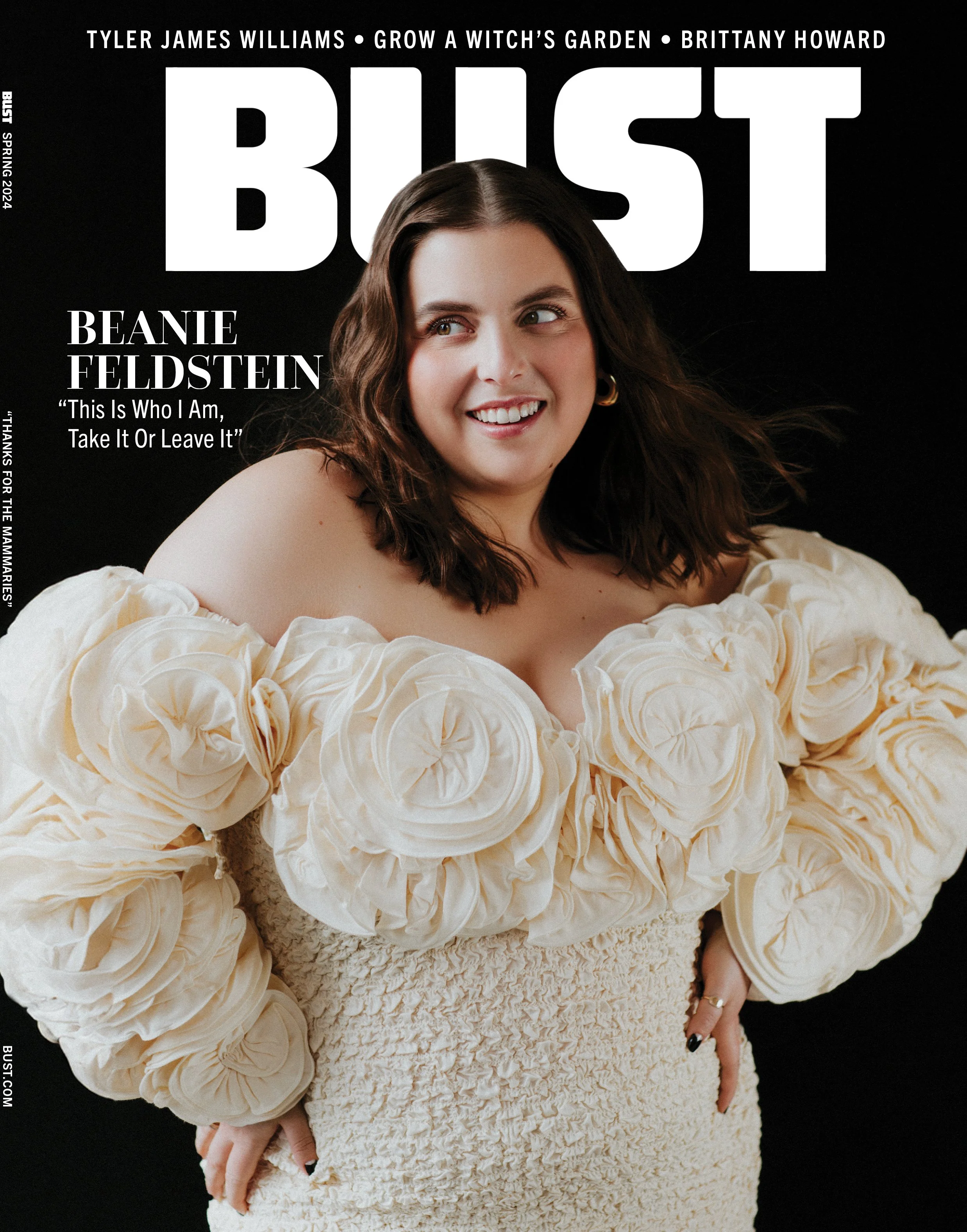 Cover of Bust magazine featuring Beanie Feldstein in a cream-colored dress with large, rosette-embellished sleeves, smiling and looking to the side.