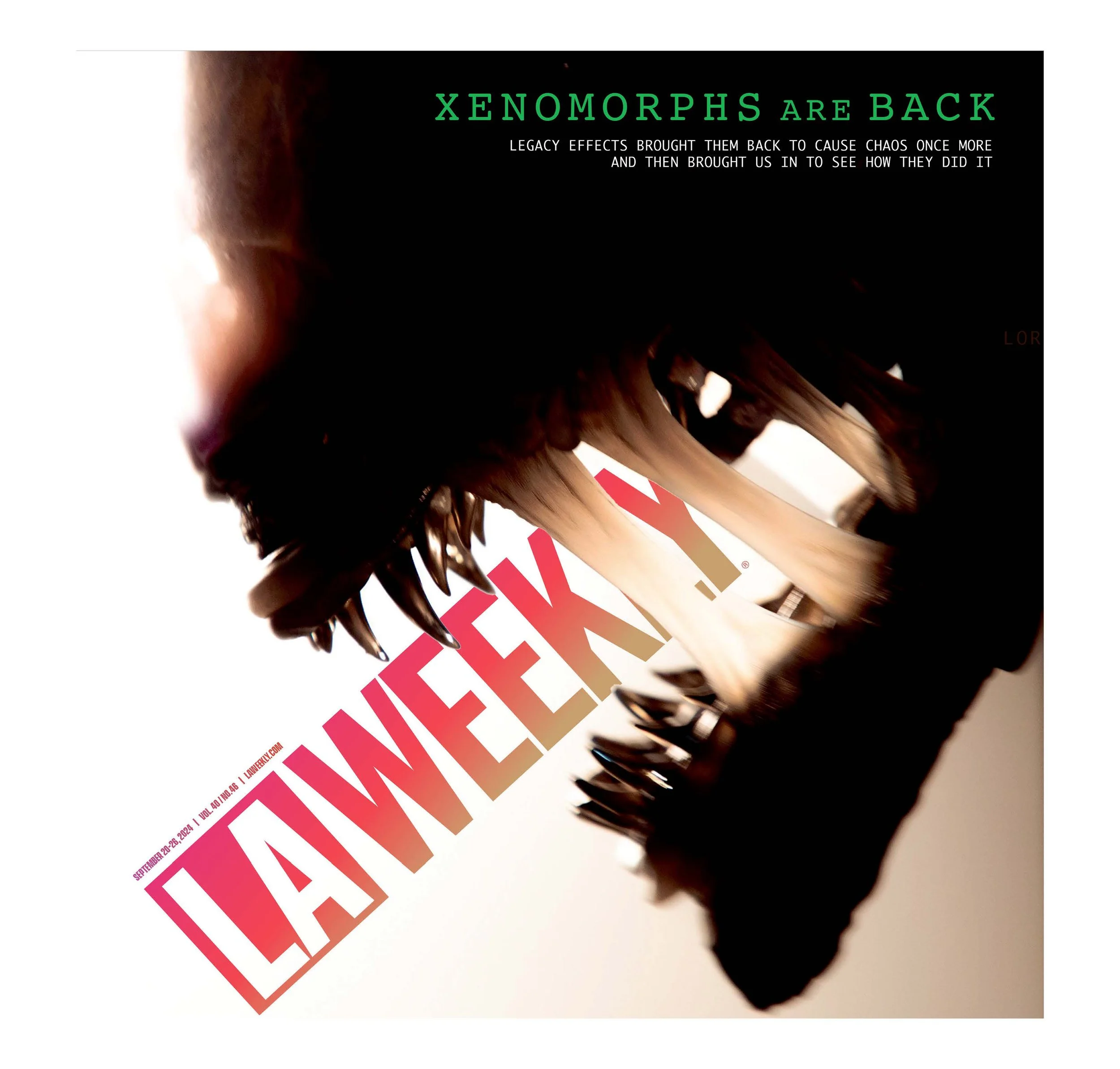 Magazine cover featuring a close-up of a dinosaur skull with large teeth, tilted with the title 'LAWEEK' in bold pink and white letters. The headline says 'XENOMORPHS ARE BACK' with smaller text about legacy effects.