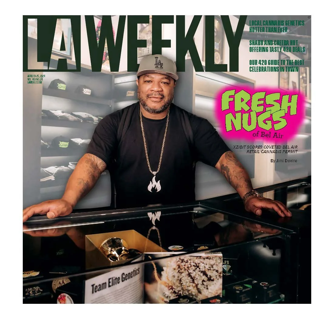 Magazine cover titled 'LA WEEKLY' featuring a man in a black shirt, gray cap, and gold jewelry, standing behind a display case of cannabis products with the headline 'FreshNugs of Bel Air'.
