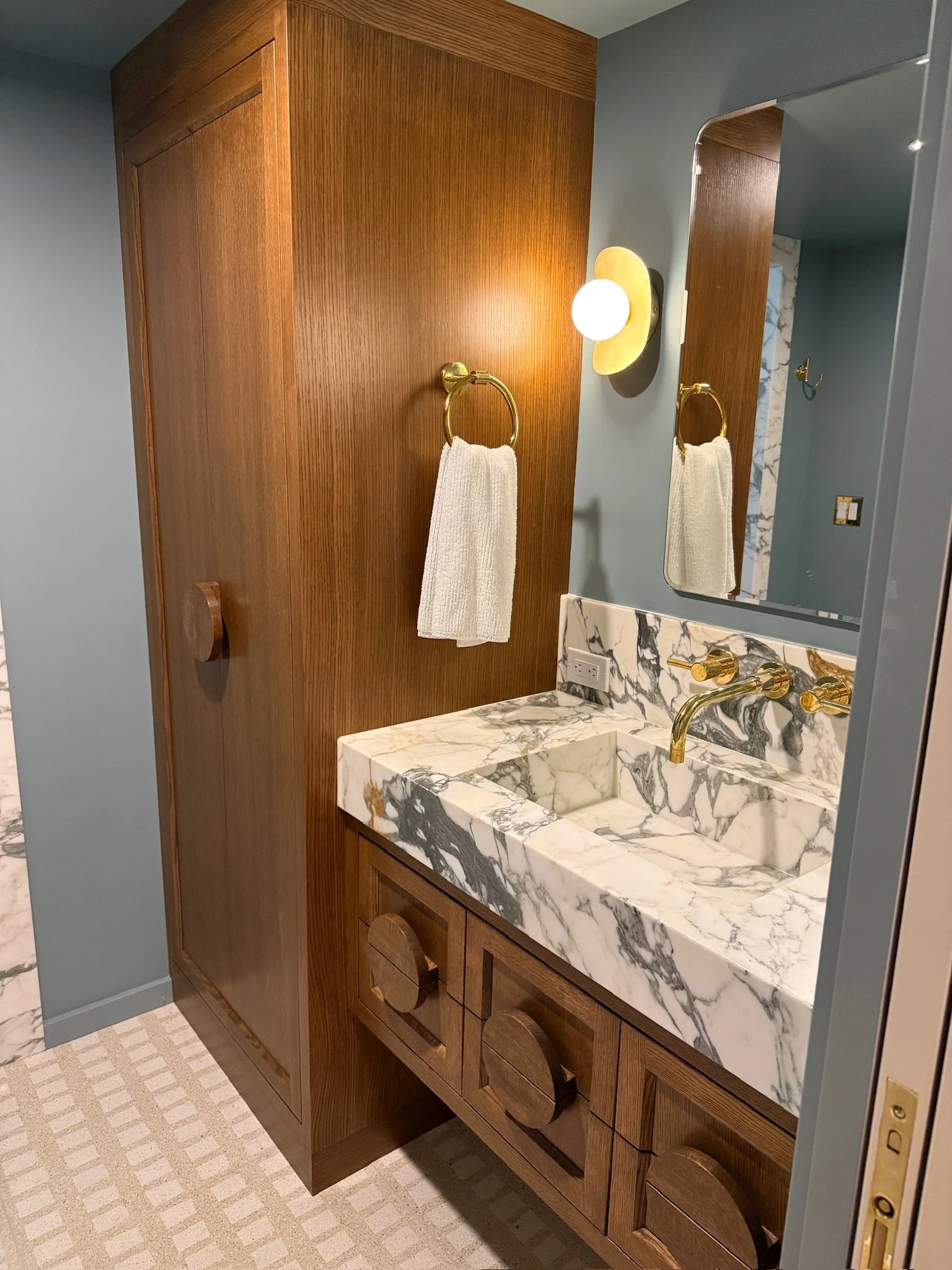 Custom bathroom vanity and linen cabinet.JPG