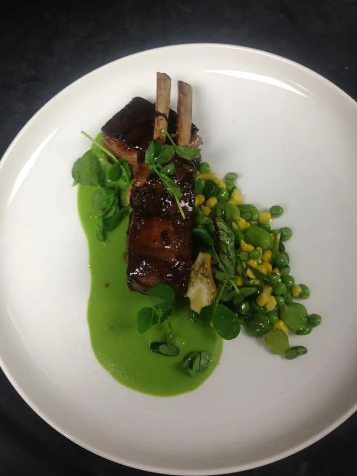 Roasted Lamb Rack and Braised Belly, Spring Pea Puree, Pea and Corn Succotash, Pickled Garlic Scape