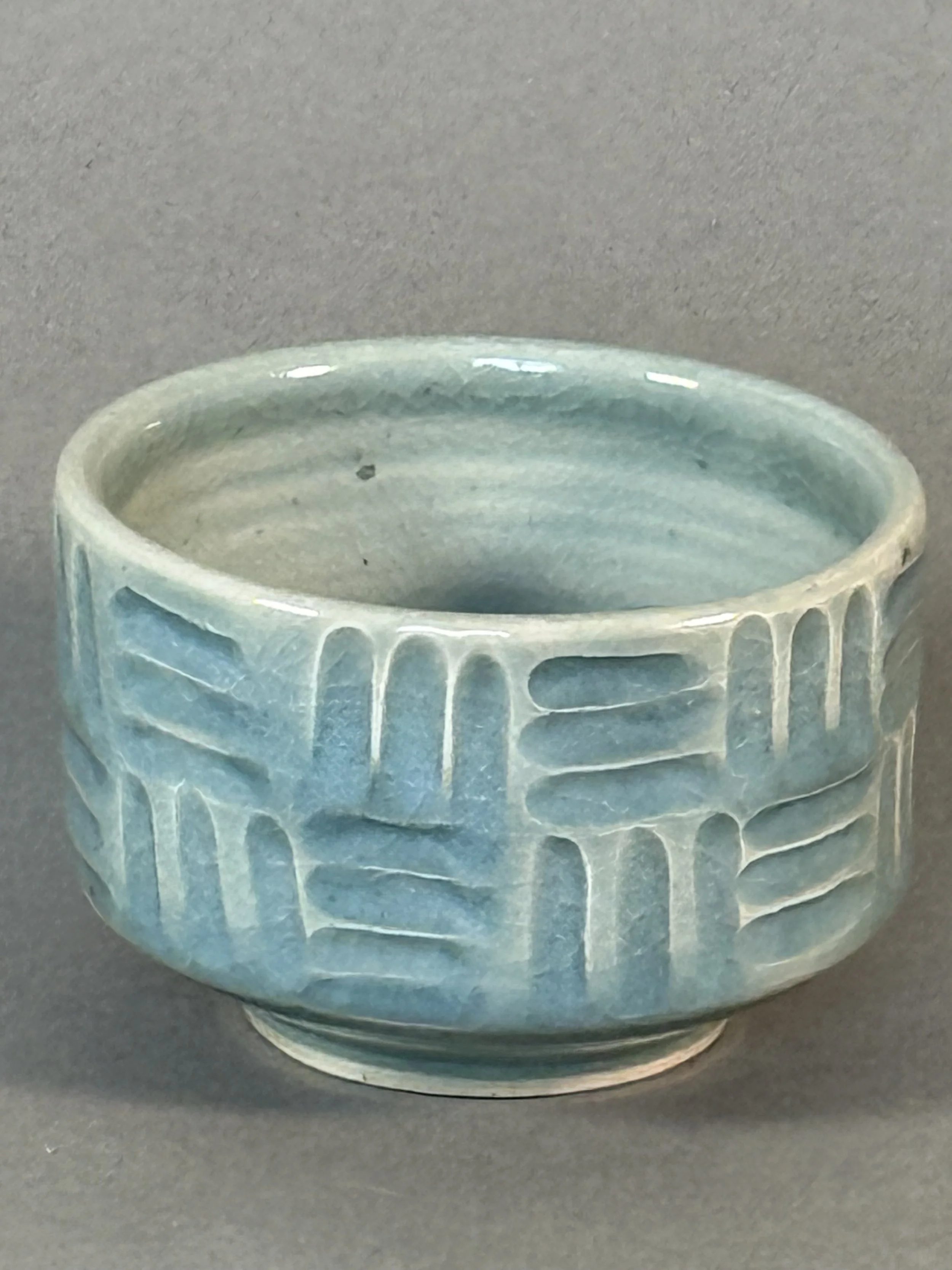 Celadon Glazed Porcelain Bowl with Geometric Carvings