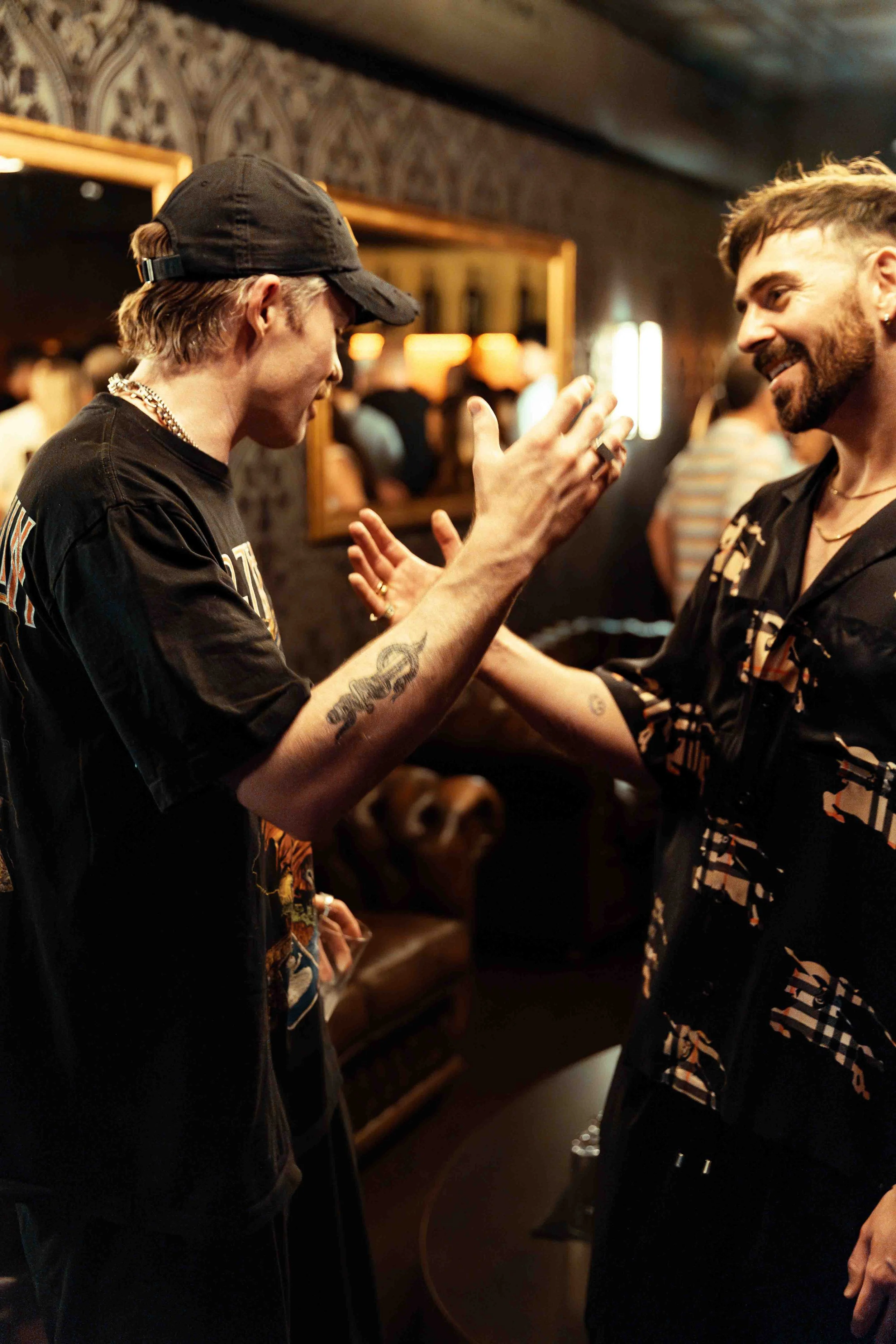 Dom dolla and Patrick topping shaking hands in the Hi greenroom