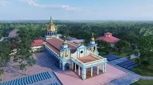 A large church or cathedral with blue and white architecture, golden domes, and a surrounding open area with trees and pathways.