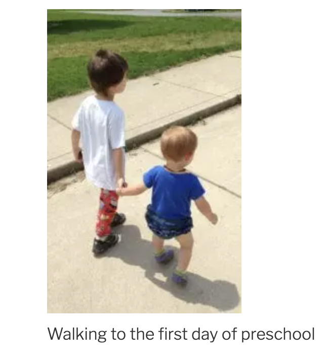 Three year old sibling walking five year old sibling to his first day of preschool, holding hands.